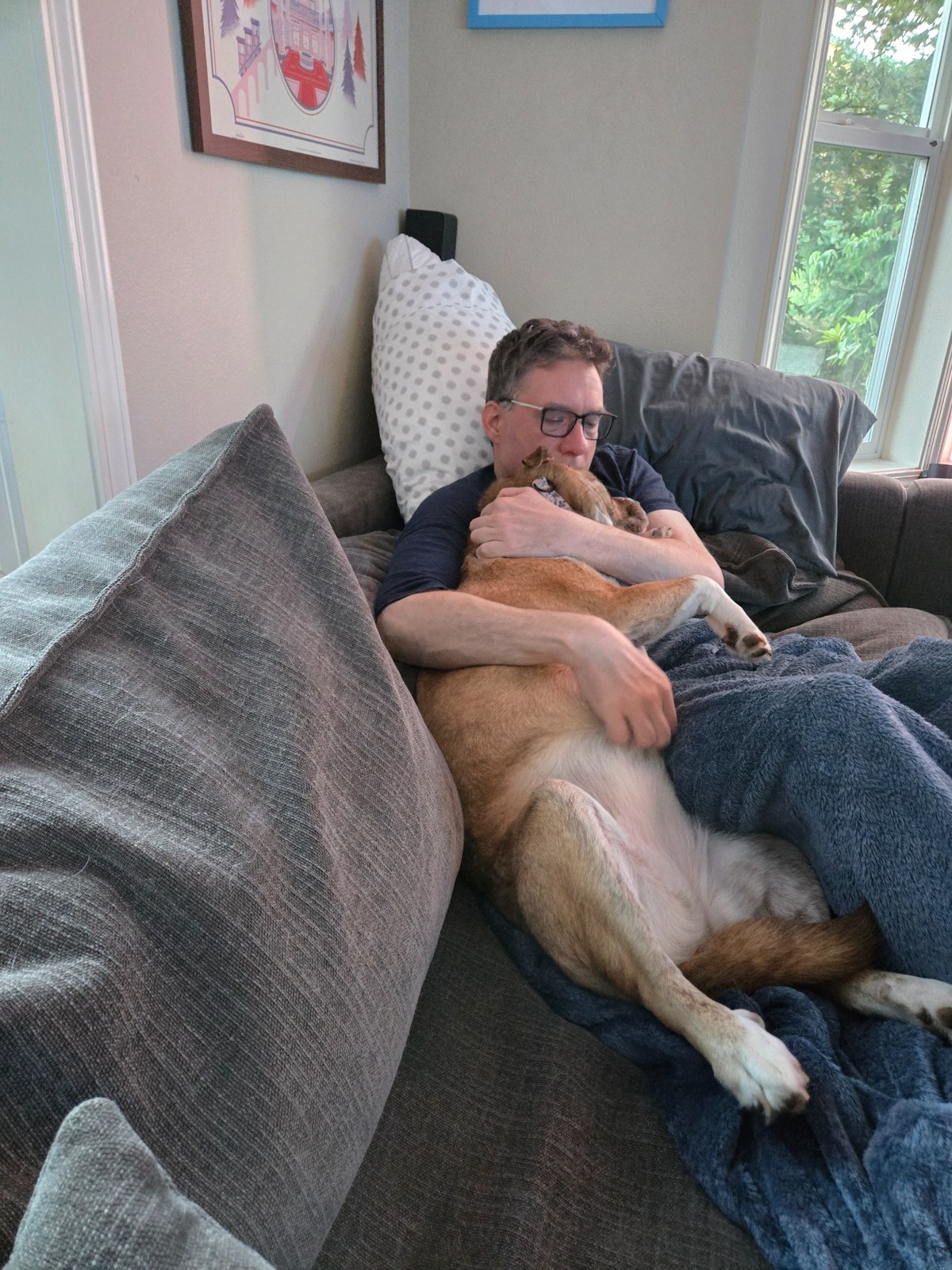 Me relaxing with our brown dog
